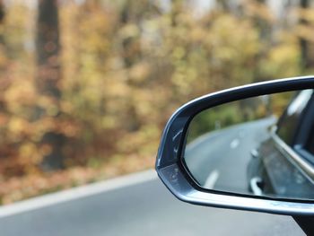 Close-up of car on side-view mirror