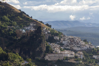 Scenic view of residential district against sky