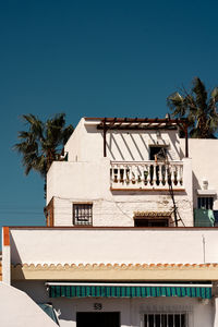 Low angle view of building against blue sky