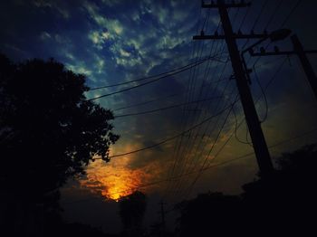 Low angle view of silhouette trees against sky during sunset