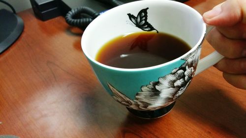 Close-up of coffee cup on table