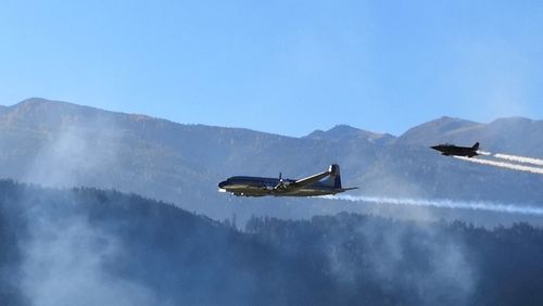 Low angle view of airplane flying in sky