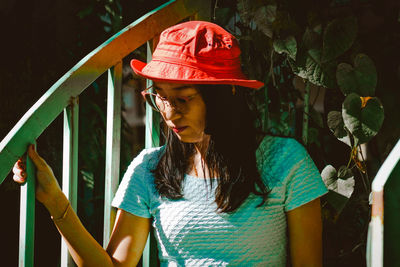 Portrait of young woman wearing hat