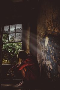 Man sitting in window