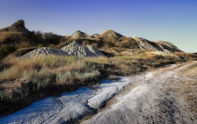 Scenic view of landscape against clear blue sky