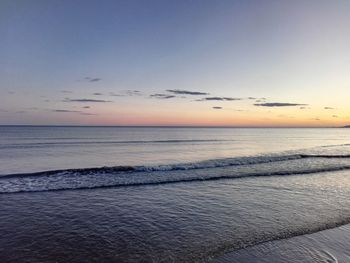 Scenic view of calm sea at sunset