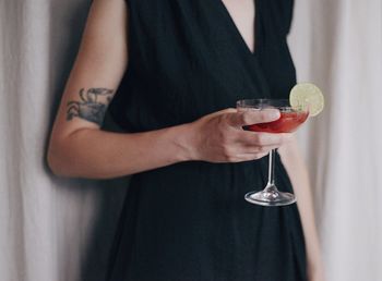 Midsection of woman holding ice cream