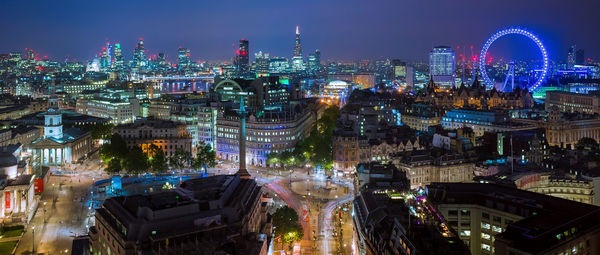 High angle view of illuminated buildings in city at night