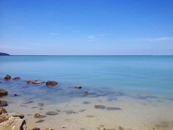 View of calm sea against blue sky