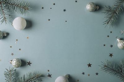 Directly above shot of christmas decorations on white background