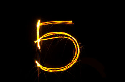 Number 5 made with light painting against black background