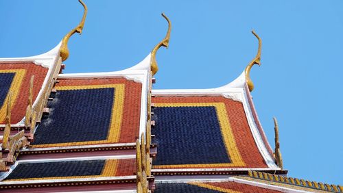 Low angle view of building against clear blue sky