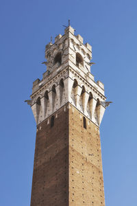 Low angle view of historical building against blue sky