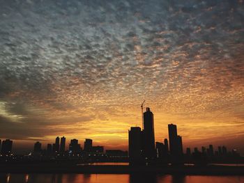 River with silhouette buildings in background