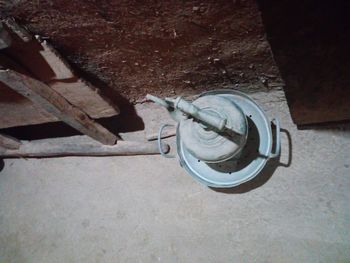 High angle view of old wheel on wall