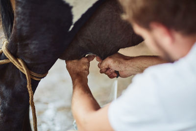 Side view of man holding dog