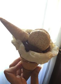 Close-up of hand holding ice cream