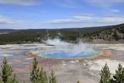 Scenic view of waterfall against sky