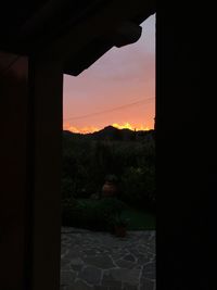 Scenic view of silhouette mountains against sky during sunset