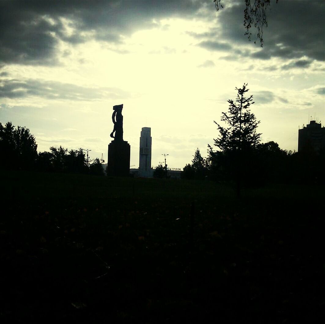 statue, human representation, sculpture, sky, art, art and craft, silhouette, cloud - sky, creativity, cloud, cloudy, memorial, religion, low angle view, monument, spirituality, outdoors