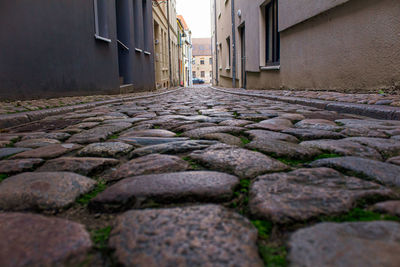 Surface level of narrow alley amidst buildings