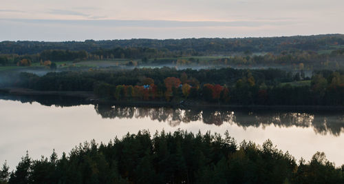 Scenic view of calm lake against sky