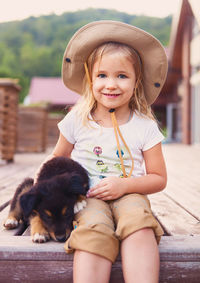 Portrait of cute girl with dog