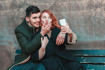 Portrait of young man using mobile phone