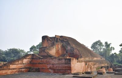 Low angle view of old ruins against clear sky