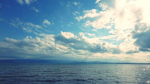 Scenic view of sea against cloudy sky