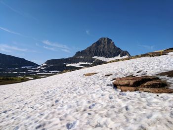 Snow on logan pass on a clear day in glacier national park 