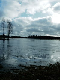 Scenic view of frozen lake against sky