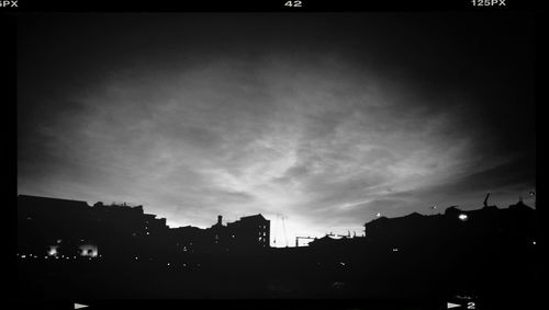 Buildings in city at dusk