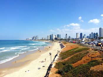 View of beach with city in background