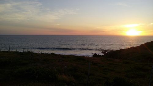 Scenic view of sea at sunset