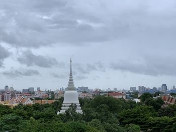 View of buildings against cloudy sky