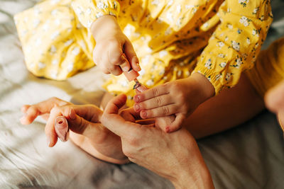 Midsection of woman holding baby