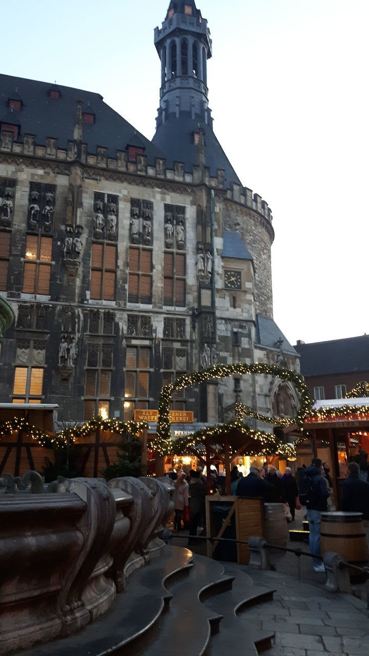 ILLUMINATED BUILDINGS AGAINST SKY