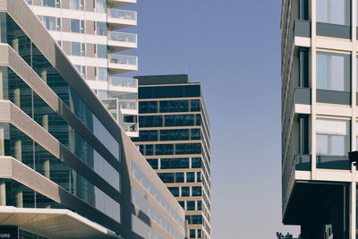 Low angle view of modern buildings against sky