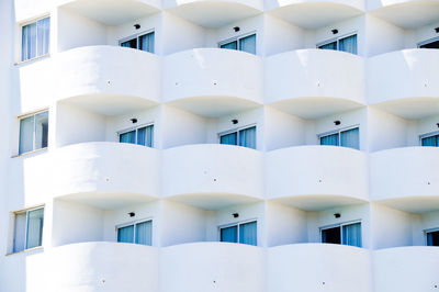 Full frame shot of white hotel apartments with balkony