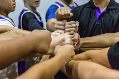 Rear view of people hands