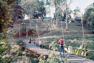 High angle view of people standing by plants