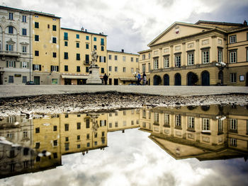 Buildings in city against sky