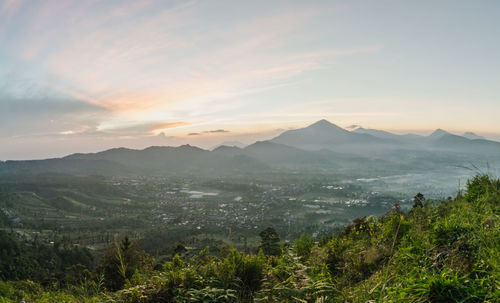 Scenic view of mountains against sky during sunset