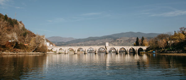 Bridge over river against sky