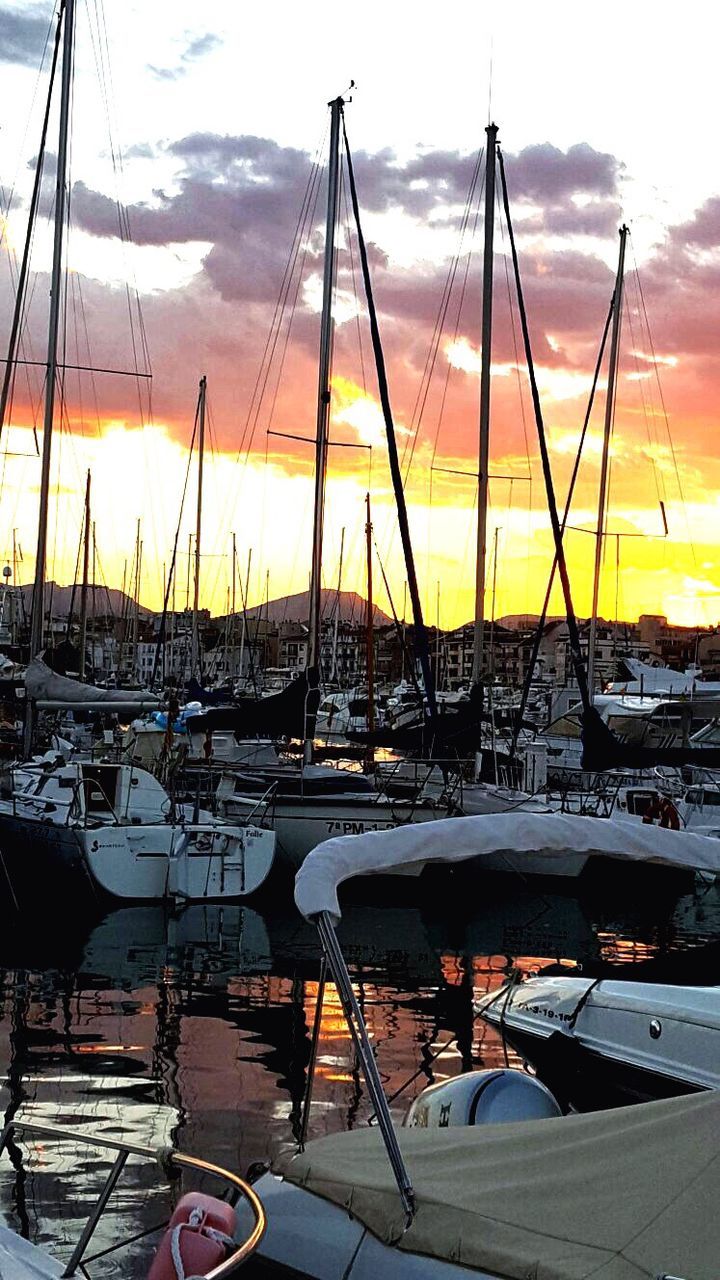 nautical vessel, transportation, mode of transport, boat, moored, sunset, water, mast, sky, sea, cloud - sky, sailboat, harbor, orange color, marina, beauty in nature, tranquility, nature, cloud, cloudy, scenics, outdoors, tranquil scene, no people, idyllic