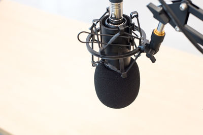 Close-up of microphone against wall