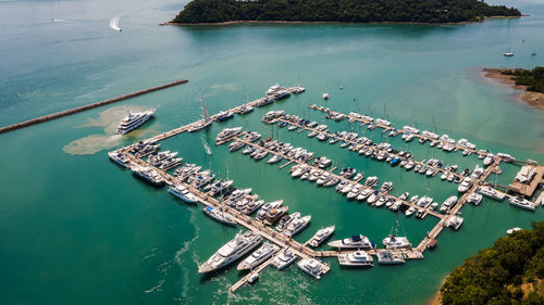 Yachts and boats in marina bay at phuket thailand aerial view