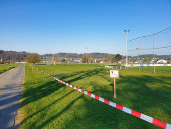 Scenic view of field against clear sky