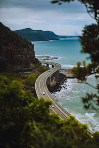 High angle view of road by sea against sky